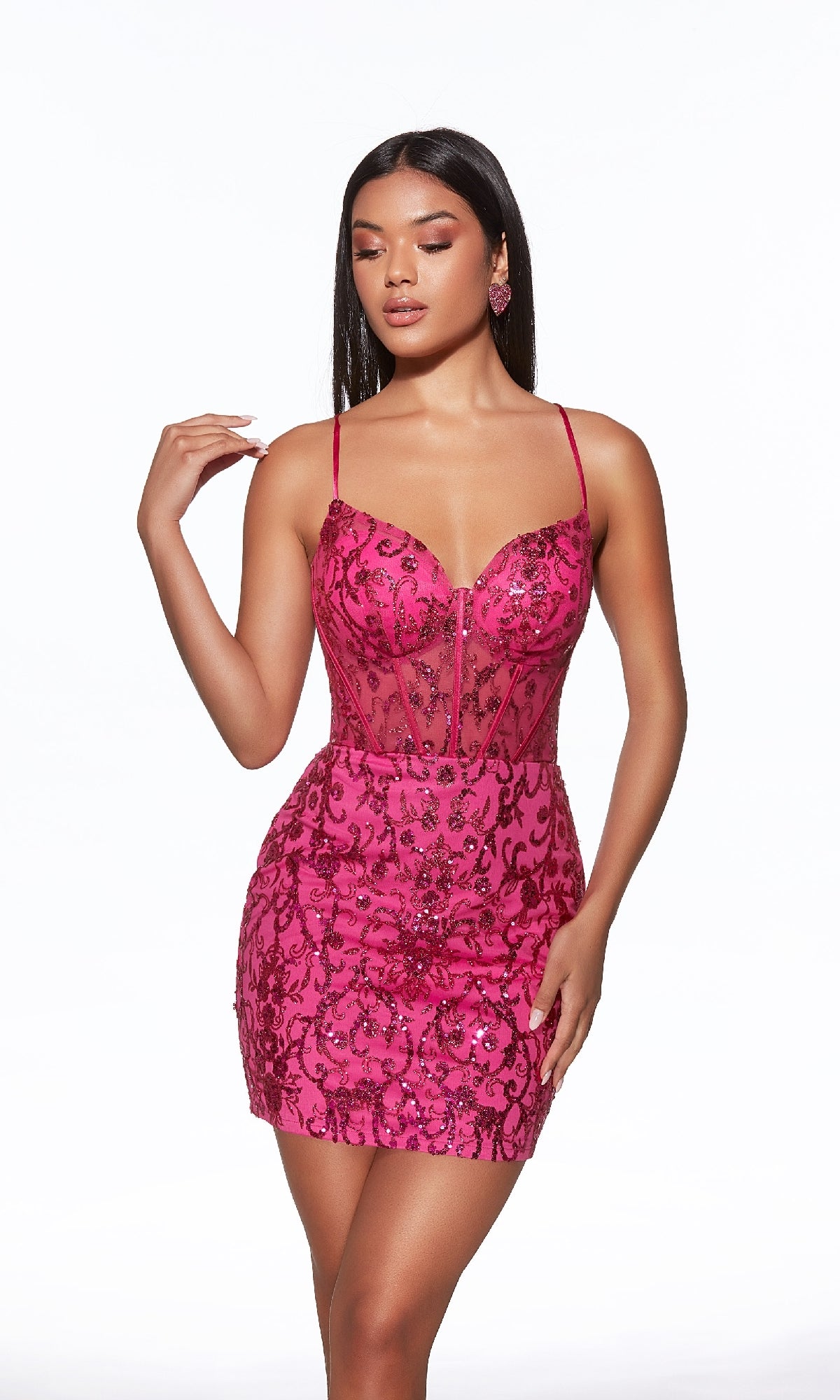 A woman wearing the Raspberry Short Beaded Hoco Dress (Alyce 40091), a fitted pink sequin party dress with spaghetti straps and sheer panel details, stands against a white background.